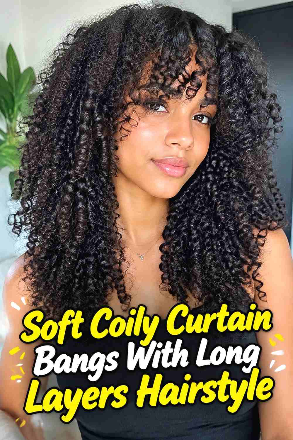 12. Soft Coily Curtain Bangs With Long Layers Hairstyle