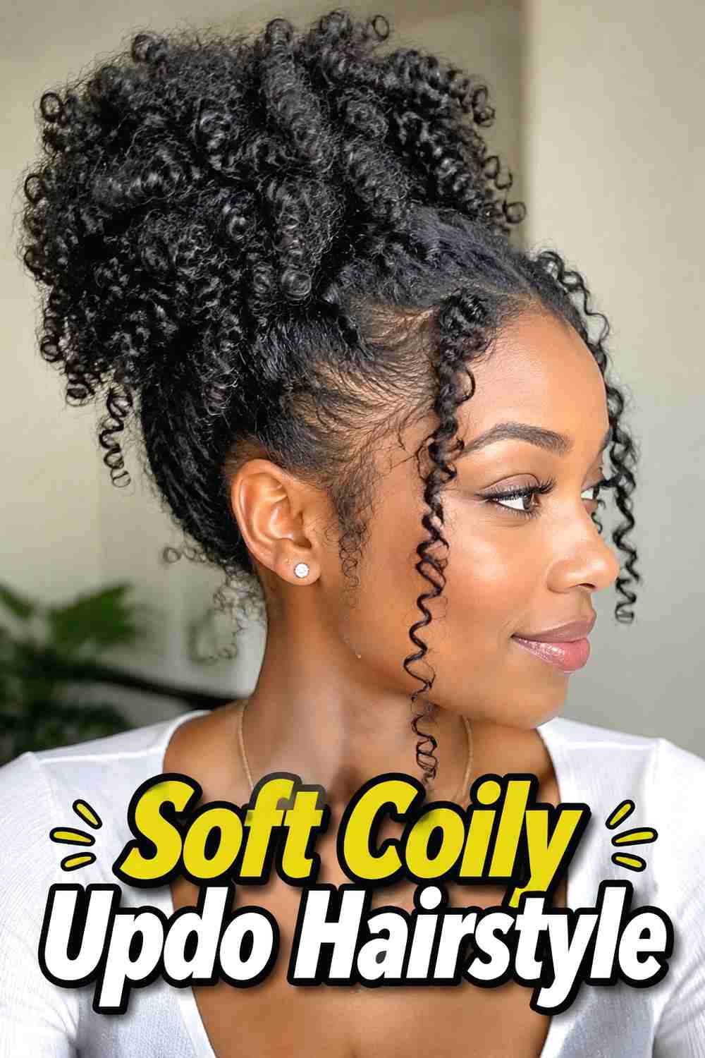 15. Soft Coily Updo Hairstyle