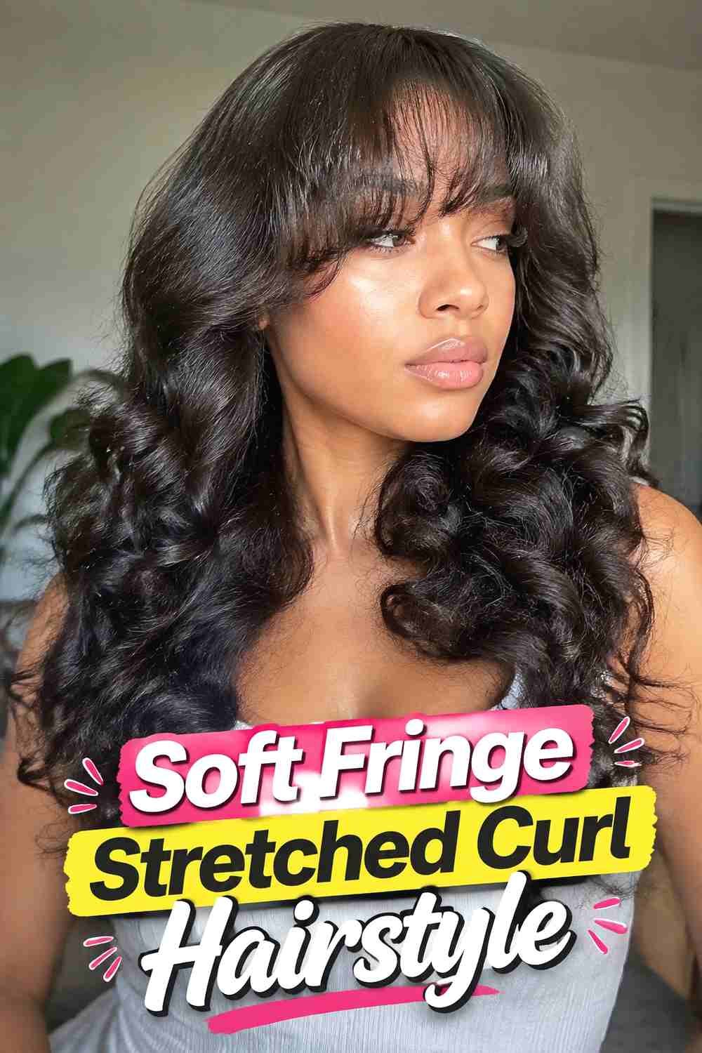 16. Soft Fringe Stretched Curl Hairstyle