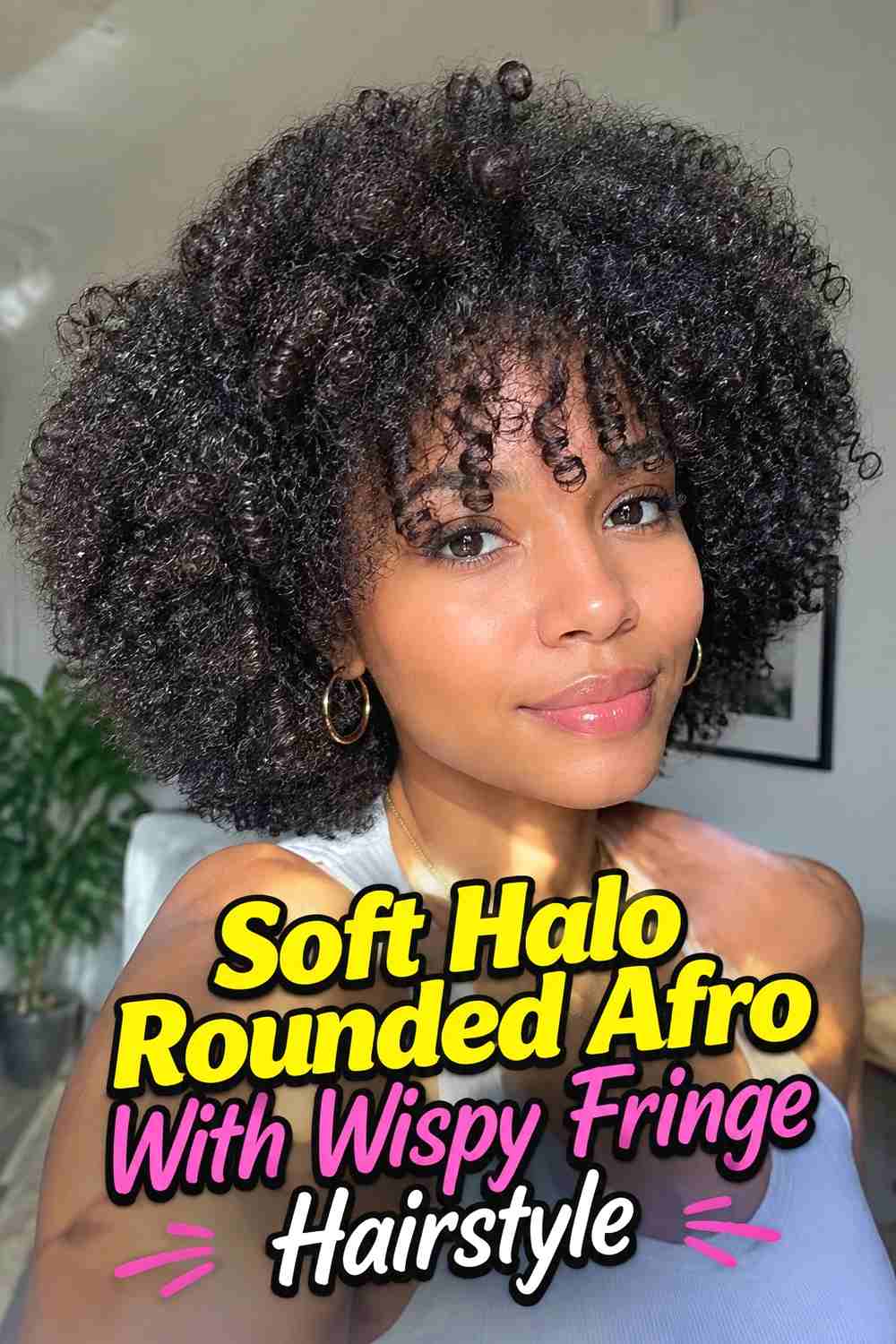 12. Soft Halo Rounded Afro With Wispy Fringe Hairstyle