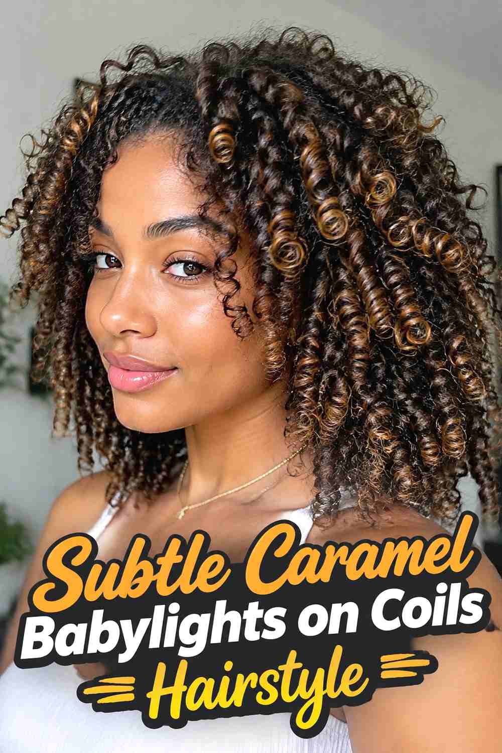 6. Subtle Caramel Babylights On Coils Hairstyle