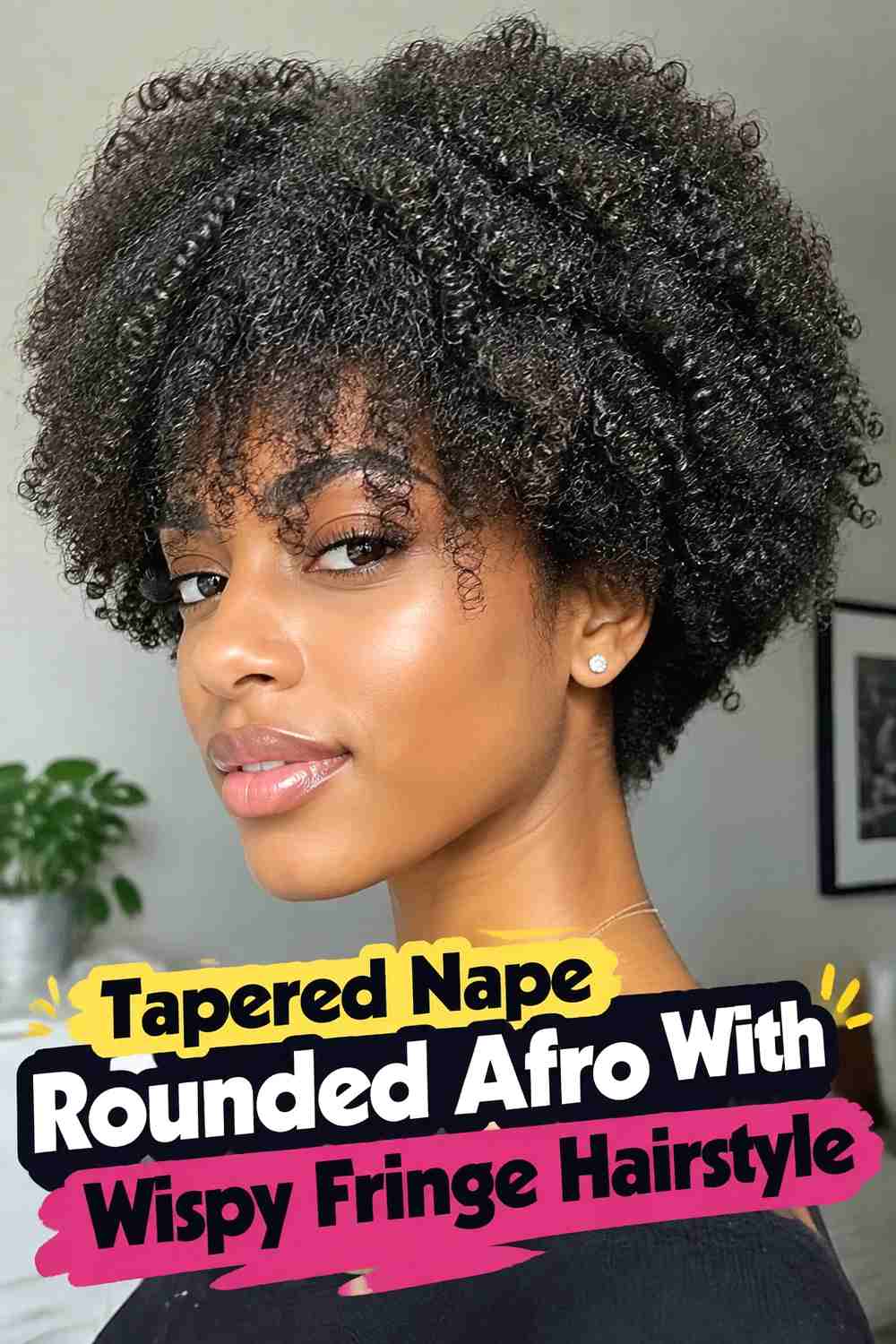 7. Tapered Nape Rounded Afro With Wispy Fringe Hairstyle