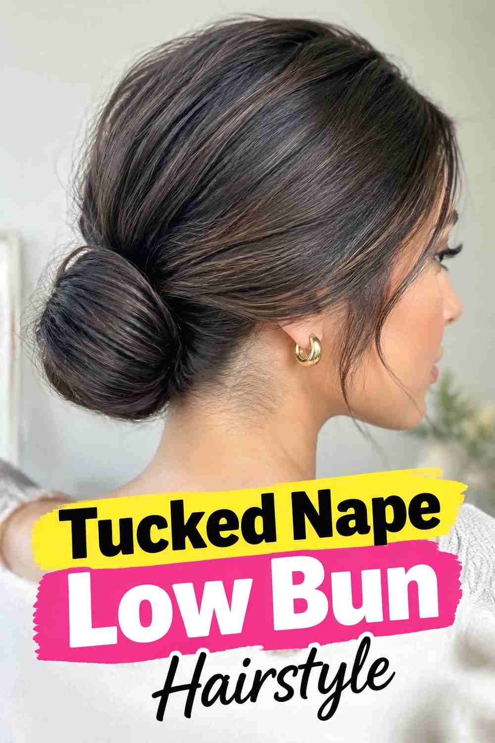 11. Tucked Nape Low Bun Hairstyle