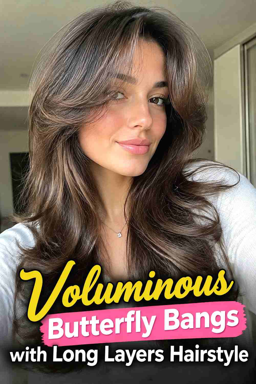 5. Voluminous Butterfly Bangs With Long Layers Hairstyle