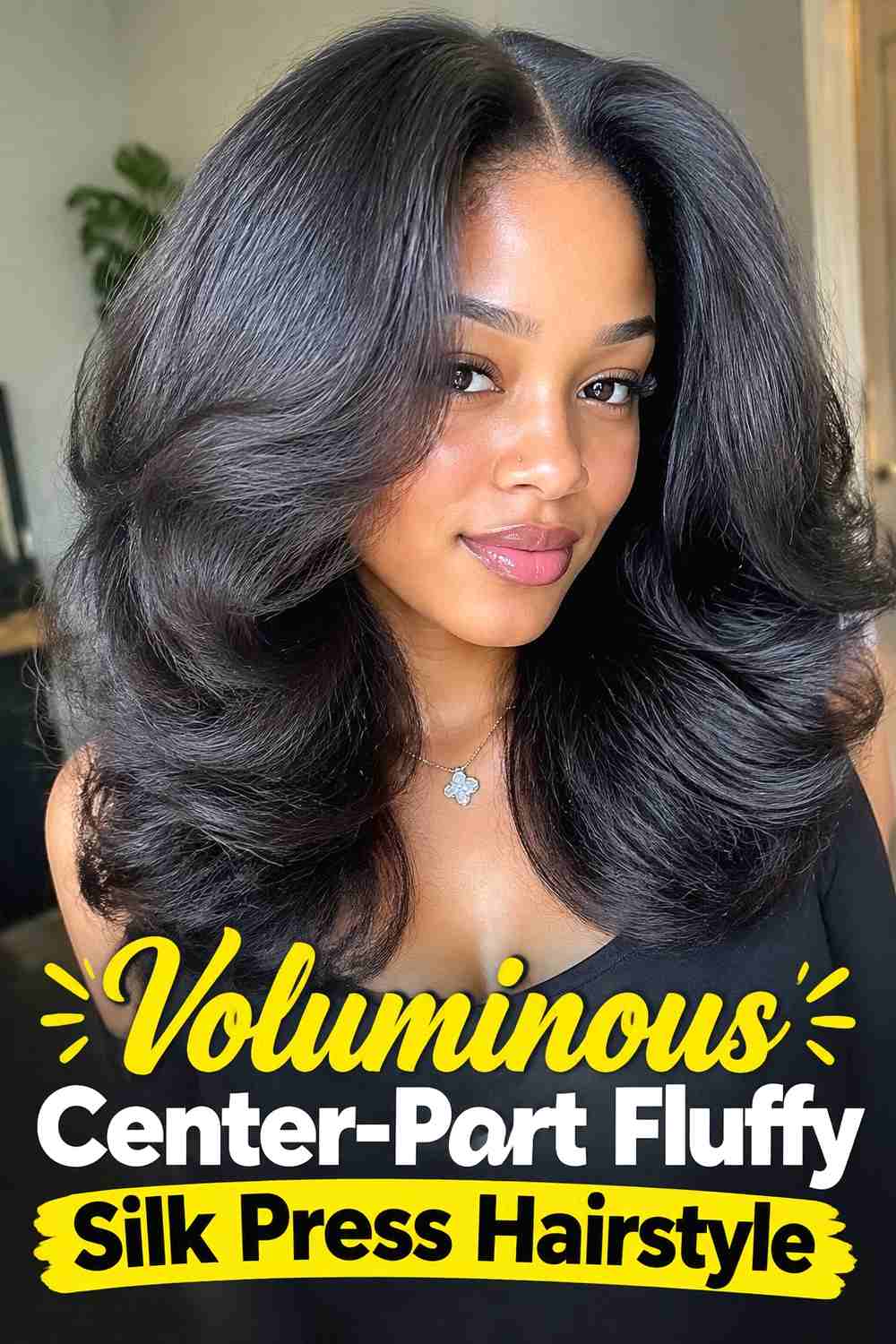 1. Voluminous Center Part Fluffy Silk Press Hairstyle