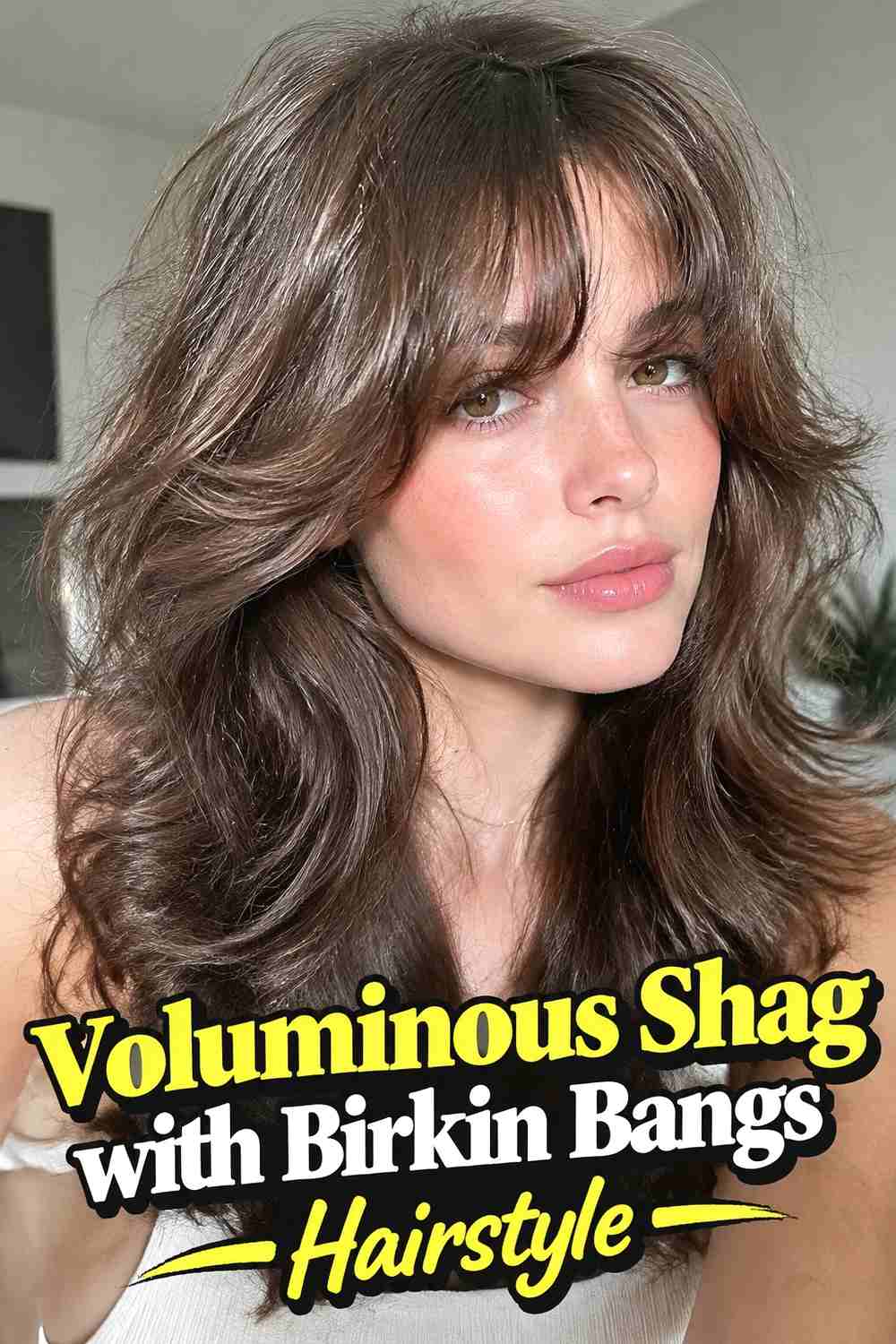 12. Voluminous Shag With Birkin Bangs Hairstyle