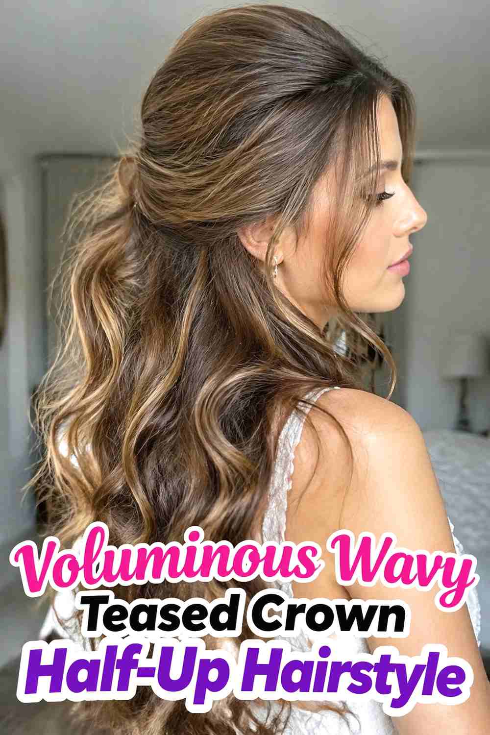 2. Voluminous Wavy Teased Crown Half Up Hairstyle
