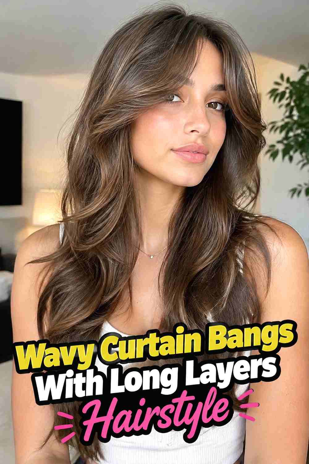 3. Wavy Curtain Bangs With Long Layers Hairstyle
